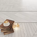 Wooden Flooring With Herringbone And Linear Patterns Stacked Books Coffee Cup And Candle