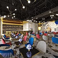 Modern Bar Interior Design With Open Layout Colorful Chairs Art Mural Chandeliers And Marble Tabletops