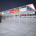 Colorful Temporary Retail Stalls With Various Signs And White Frame At Night