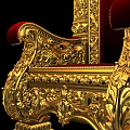 Intricate Golden Carved Throne With Red Upholstered Seat And Armrests