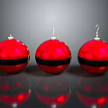 Red Christmas Ornaments With Black Stripes And Metallic Hooks On Gray Surface