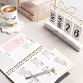 Elegant Modern Desk With Gold Legs Light Top Table Lamp Calendar Notebooks And Matching Chair