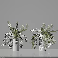 White Orchid Arrangement With Green Leaves and Small Blooms in White Vases for Home Decor