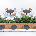 Outdoor Round Tables And Chairs Set With Green Plants For Seating Area