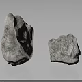 Two Natural Stone Rocks With Rough Reflective Surface Texture On Gray Background