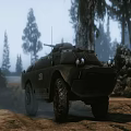 Military Tank In Desert Terrain With Rocky Landscape And Mountain Background