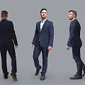Men In Dark Blue Suits Showing Back Front And Side Views Against Gray Background