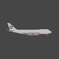Dark Colored Airplane Flying With White Wings And Tail Logo In Sky