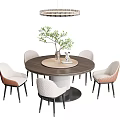Modern Round Dining Table Set With White And Brown Chairs Green Plant And Chandelier