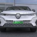 White Renault Electric SUV With Sleek Design And Modern Front Grille