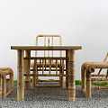 Natural Bamboo Outdoor Table with Matching Chairs in Garden Patio Gravel Setting