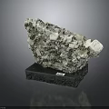 Natural Raw Stone Specimen With Crystal Structure On Black Base