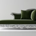 Green Velvet Chaise Lounge With Silver Ornate Frame And Plush Pillows