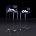 Sculpture Carving Display With Metallic Frame Stand And White Artworks On Black Background