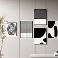 Black And White Abstract Wall Art With Potted Plant And Shelf Decor Items