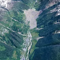 Scenic Mountain Valley Landscape With Snow Capped Peaks Lush Green Vegetation And Winding Streams