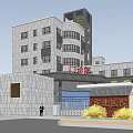 Modern Multi Story Building With Gray Exterior Green Roof Entrance Area And Surrounding Trees