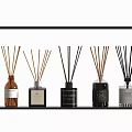 Assorted Scented Fragrance Diffuser Bottles with Reed Sticks Displayed on Shelf