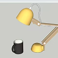 Stylish Table Lamp with Yellow Lampshade and Wooden Arm Alongside Black Mug