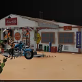 Aerial Planning of Miniature Desert Scene With Road Layout Building Cacti and Motorcycle