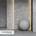 Spherical Stone Component In Modern Interior With Textured Gray Walls And Ambient Lighting