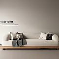 Poliform Three Seater Sofa With Light Colored Upholstery Accent Pillows Throw Blanket And Wooden Base