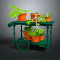 Various Green Plants In Orange Pots On Mobile Green Cart With Wheels