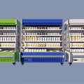 Commercial Display Refrigerators in Green Blue and White with Organized Shelves of Beverages and Food