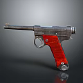 Vintage Style Metallic Pistol With Red Textured Grip And Shiny Detailed Body
