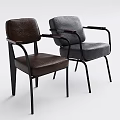 Two Stylish Leather Chairs With Brown And Gray Upholstery Black Metal Frames And Armrests