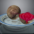 Fresh Whole And Cut Beetroot With Vibrant Red Flesh On A Plate