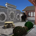 Traditional Chinese Garden Landscape With Carved Relief Walls Stone Table And Green Shrubs