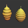 Two Yellow Spiral Stacked Sculptures With Reflective Bases On Dark Surface