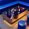 Elegant Modern Coffee Table With Metallic Frame Glass Top Wine Bottles And Fruit Platter