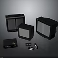 Three Vintage Black Monitors Of Various Sizes With Retro Electronic Accessories