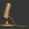 Golden Microphone With Stand Base And Extended Cable On Dark Background