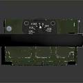 Green Industrial Device With Black Handle And Yellow Information Label