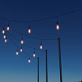 Outdoor Hanging Decorative String Lights With Black Poles Against Blue Sky Evening