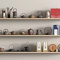Assorted Teaware On Light Wooden Shelves With Teapots Jars Colorful Boxes And Tea Cakes