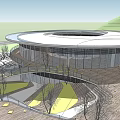Modern Cultural Center Building With Circular Glass Facade And Surrounding Trees