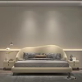 Modern Double Bed with Beige Upholstered Headboard Patterned Pillows Nightstands Table Lamps and Gray Rug