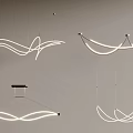 Modern Chandeliers with Curved Sleek Lines and White Illuminated Accents for Contemporary Interior Spaces
