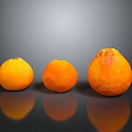 Three Oranges of Different Sizes on Black Background with Reflections 3d model