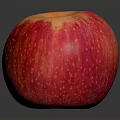 Fresh Red Apple With Yellow Spots On Dark Reflective Surface