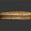 Round Layered Cake With Golden Crumbles And Cream Filling On Dark Background