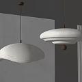 Two Modern Curved Fabric Pendant Chandeliers With Soft Lighting In Minimalist Interior