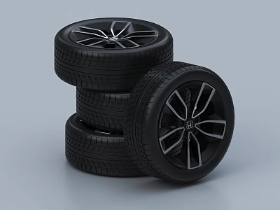 Three Black Car Tires Stacked With Modern Rims Featuring Silver Spokes Design 3d model
