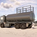 Silver Tanker Truck with Metal Rails on Sandy Ground Under Blue Sky