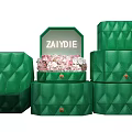 Elegant Green Quilted Jewelry Boxes with Open Top Showing Pink Flowers Inside