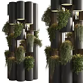 Modern Vertical Living Plant Wall With Black Cylindrical Structure And Lush Green Plants